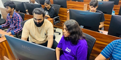 Students working through practice tasks in the lab