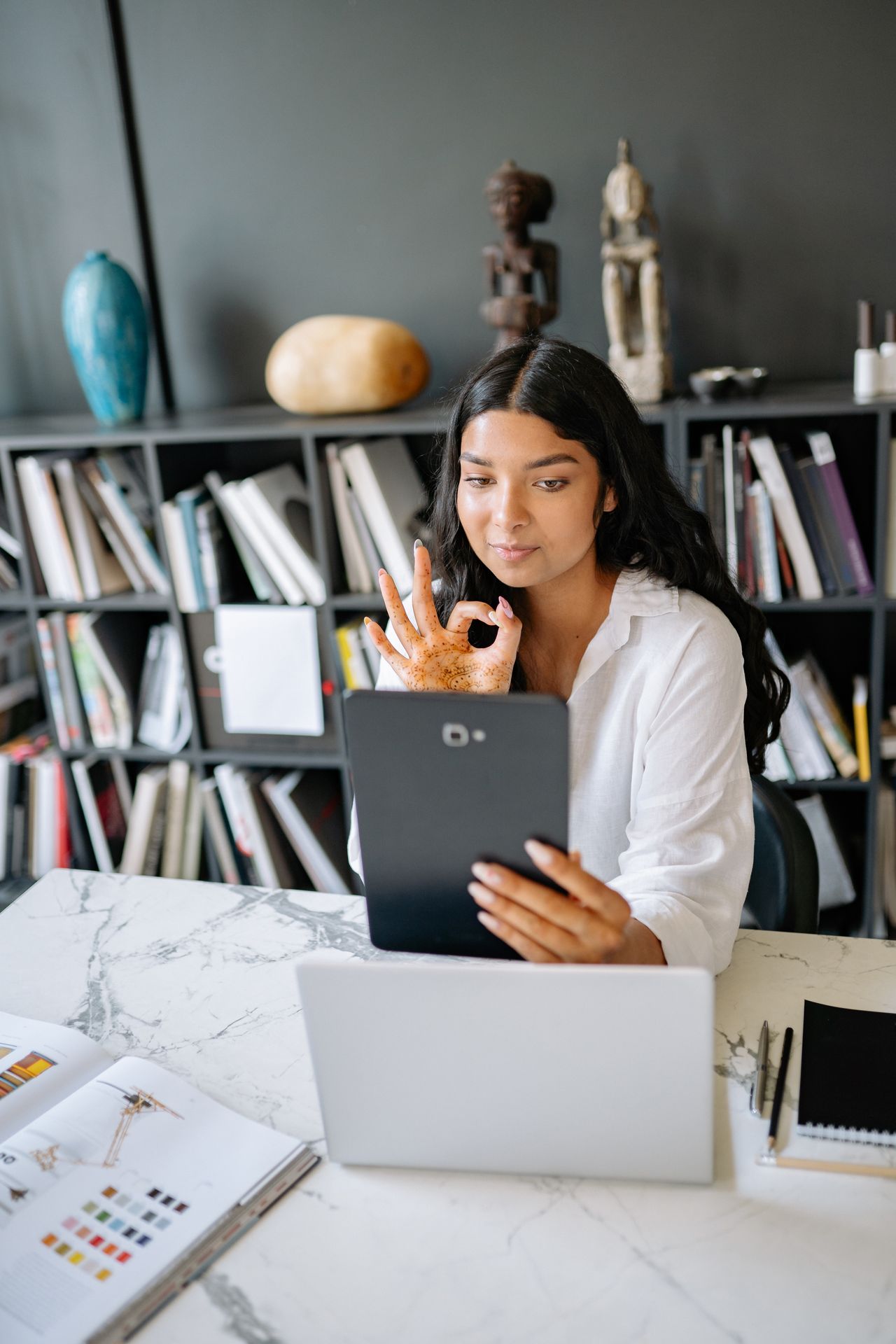 Franchise manager reviewing centre plans on a tablet